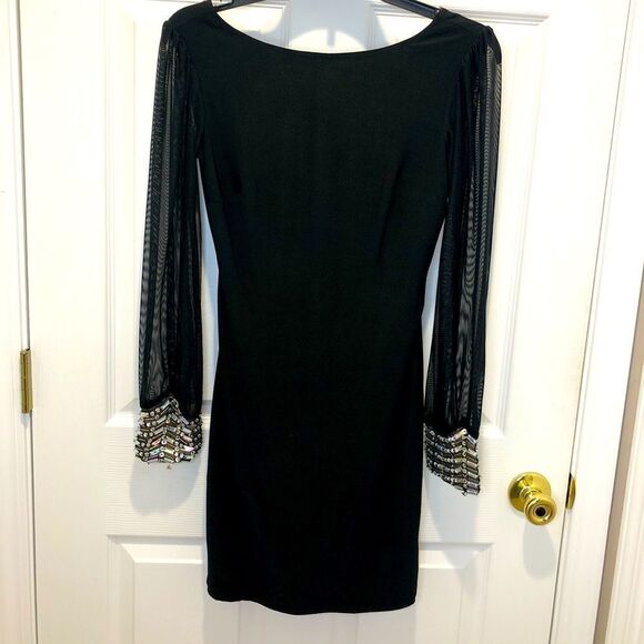 Jodi Kristopher Dresses & Skirts - Jodi Kristopher black mini dress with long sheer sleeves and rhinestone cuffs